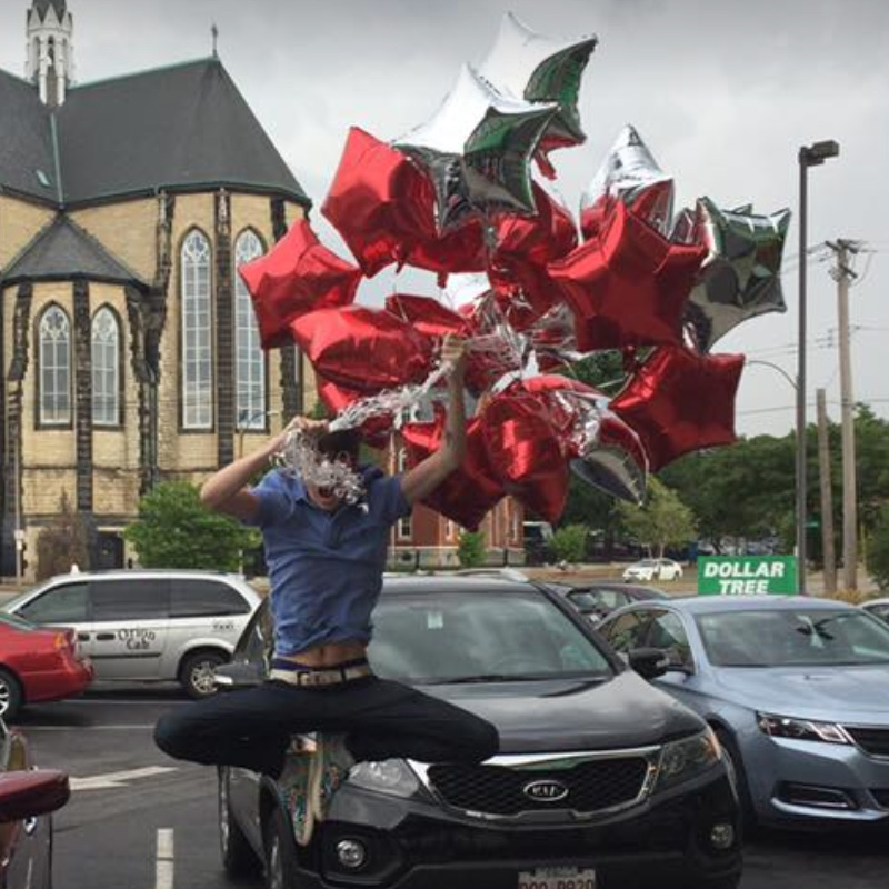 James our Senior Digital Strategist and SEO expert doing the Steve Aoki jump with balloons.