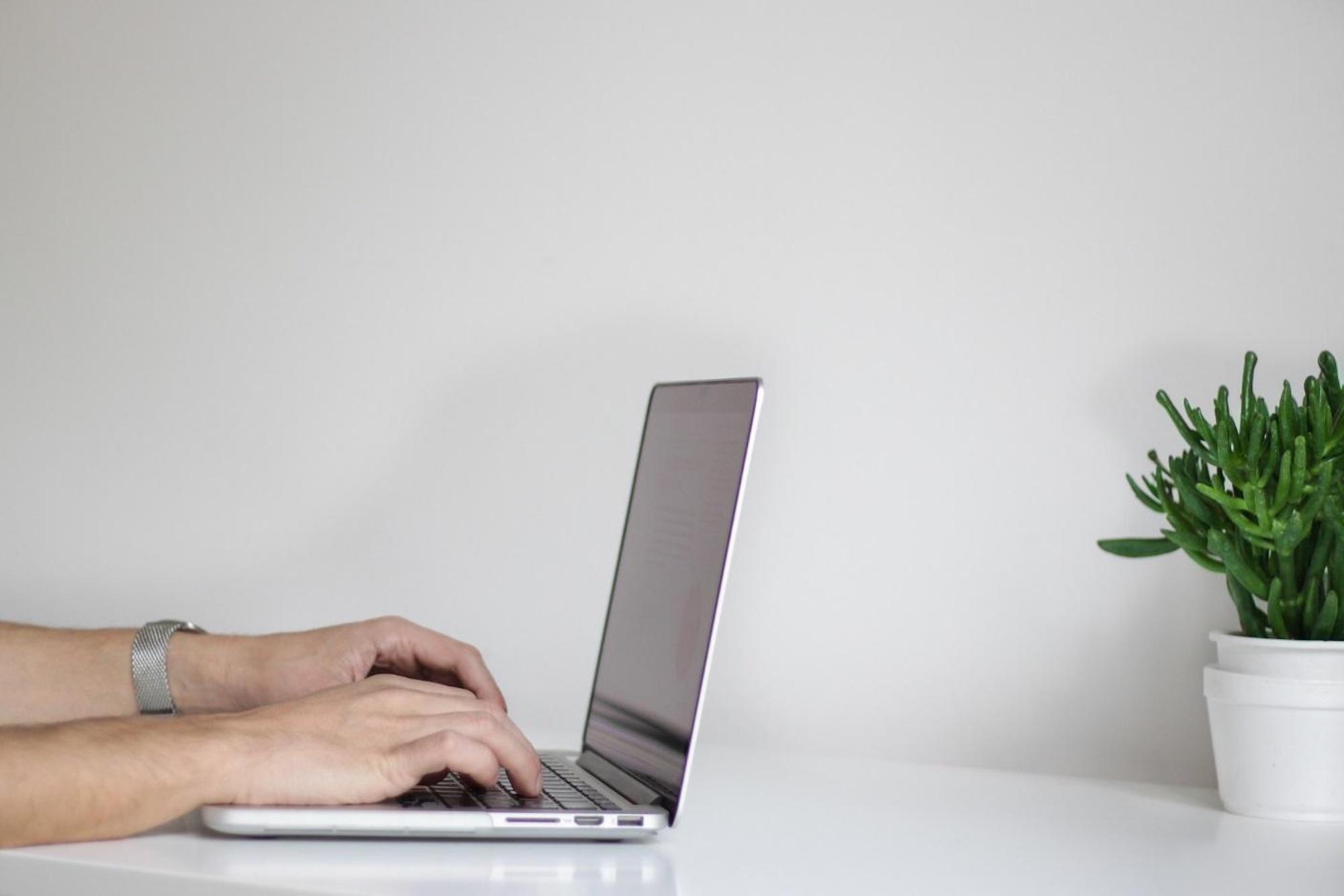 Minimalist Work Space | Matchbox Design Group | St. Louis, MO Laptop being used at your home office.