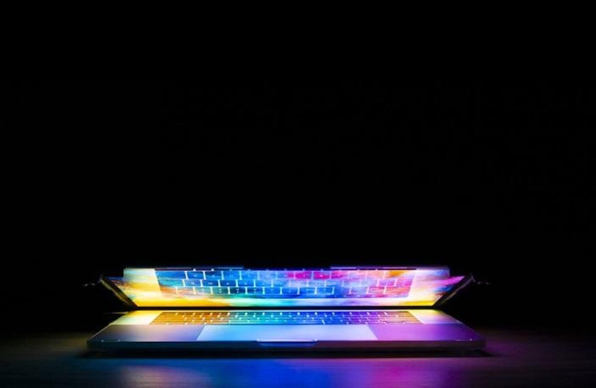 Tips On Great Web Design That Attracts Customers. Colorful laptop opening.