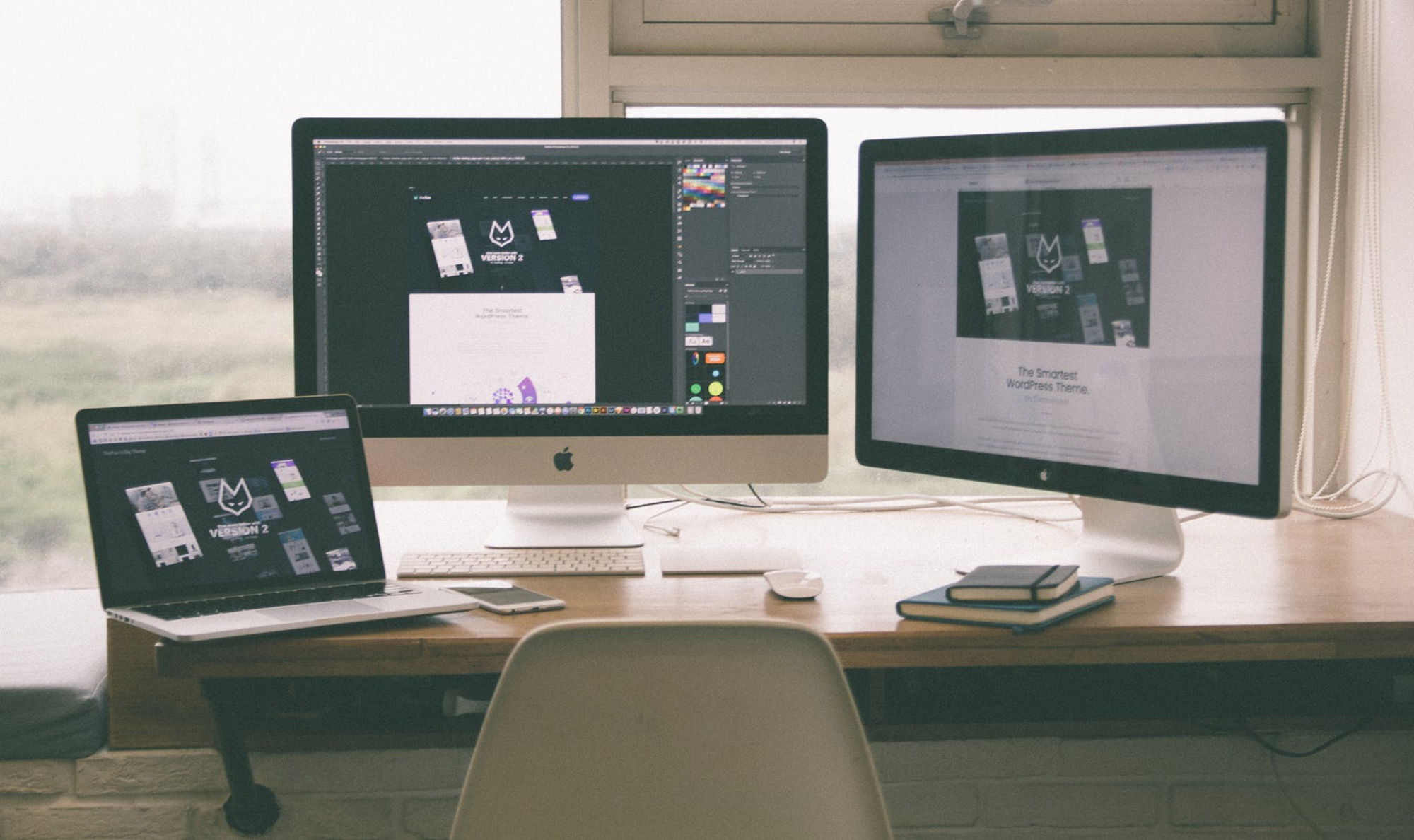 Website designs on computer screens