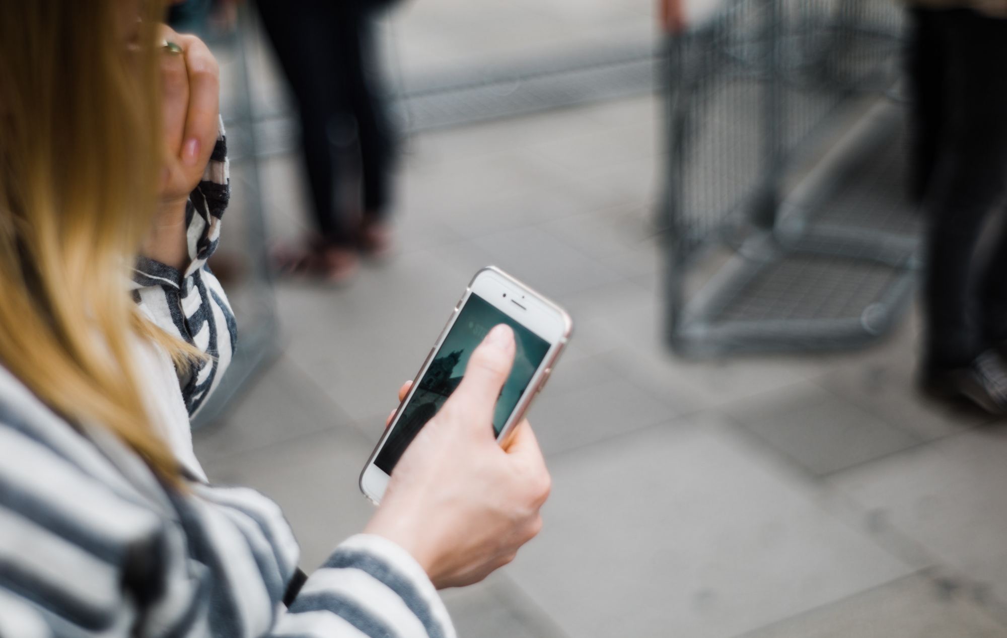 A girl using her cell phone showing off responsive web design.