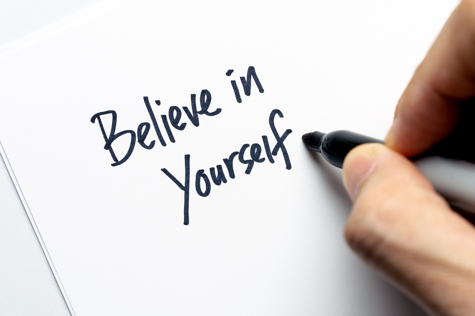 A slogan "believe in yourself" is part of the slogan creation process.