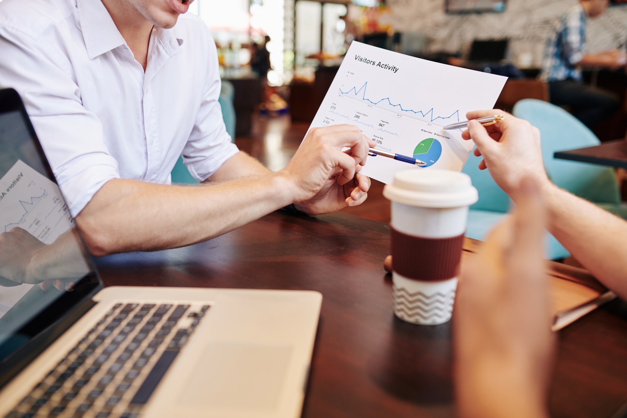 Business people discussing 3 reasons to build a website for your small business.