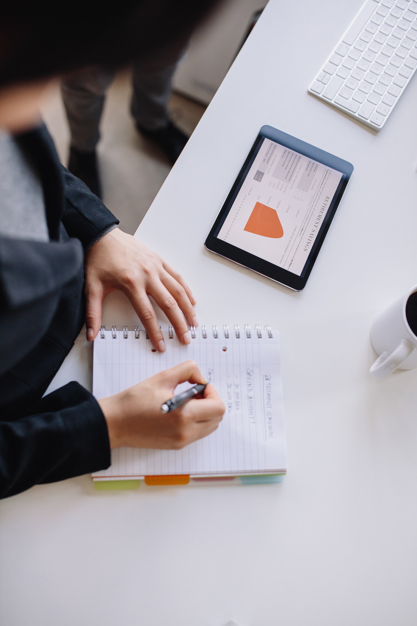 An ADA Compliant Checklist For Websites In 2020 | Designing Websites To Be Compliant | Matchbox Design Group | St. Louis, MO Businesswoman creating an ADA compliant checklist for 2020.
