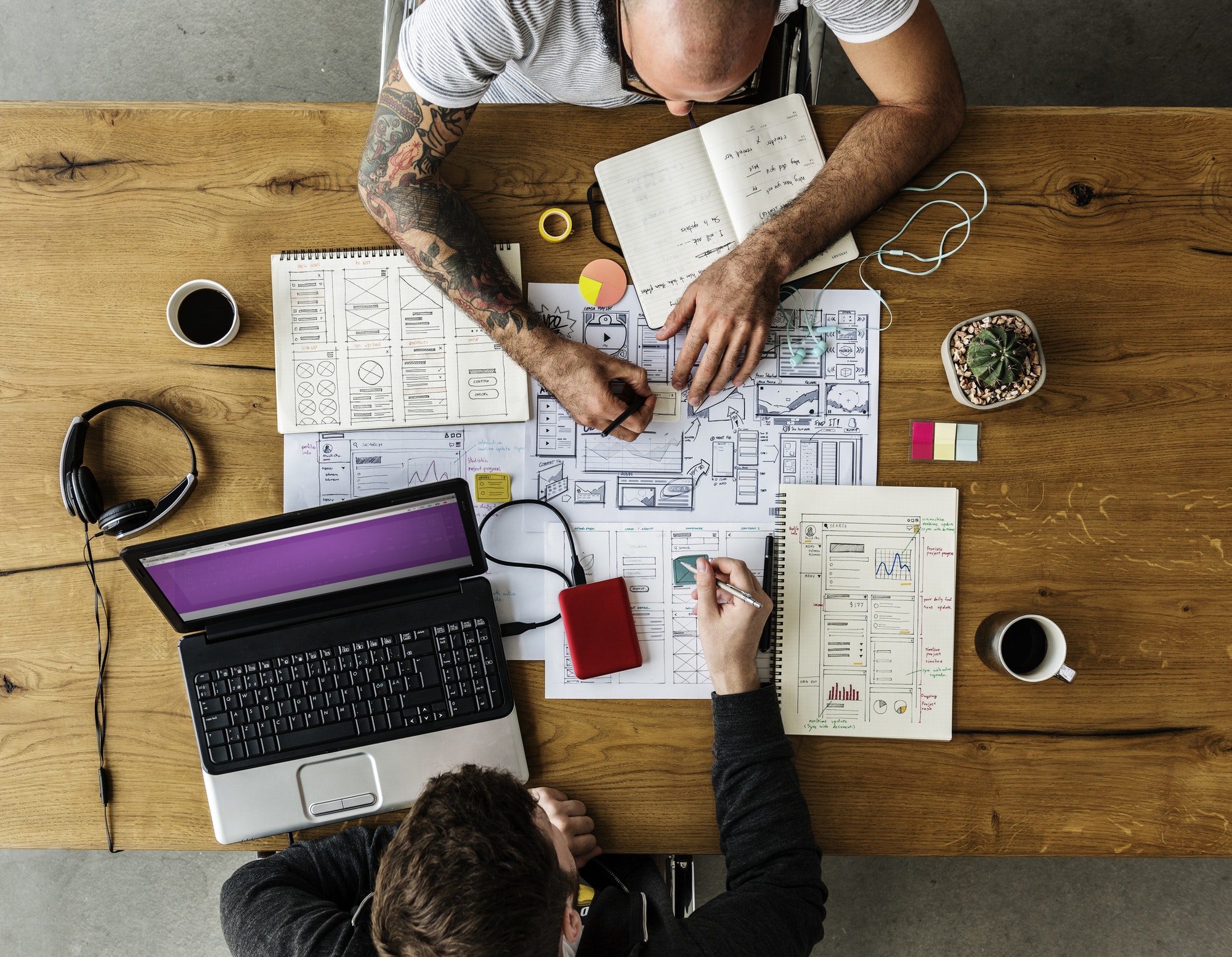 We hope you use these 8 web design tips just like the two people in this picture are doing to help your website rank.