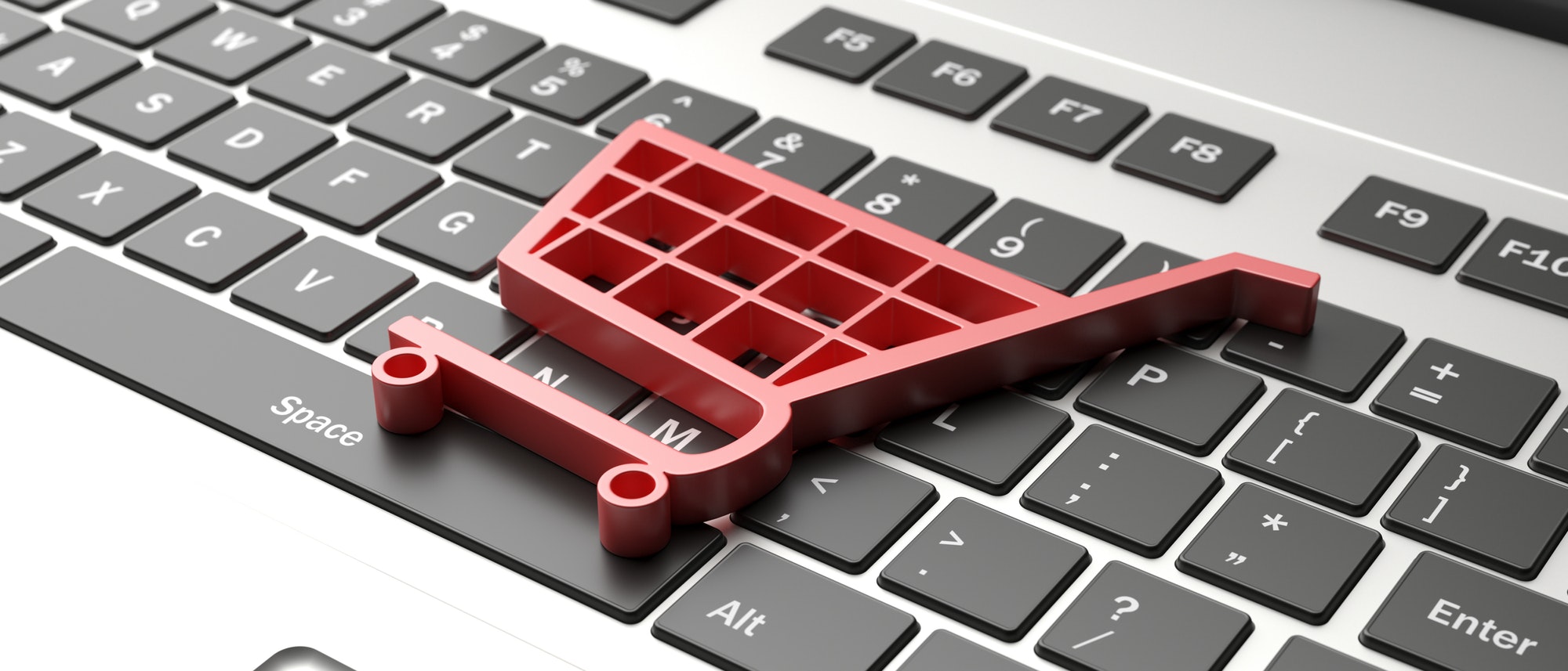 Key Requirements To Consider When Establishing An Online Business | Matchbox Design Group | St. Louis, MO e-commerce symbol on a computer keyboard.