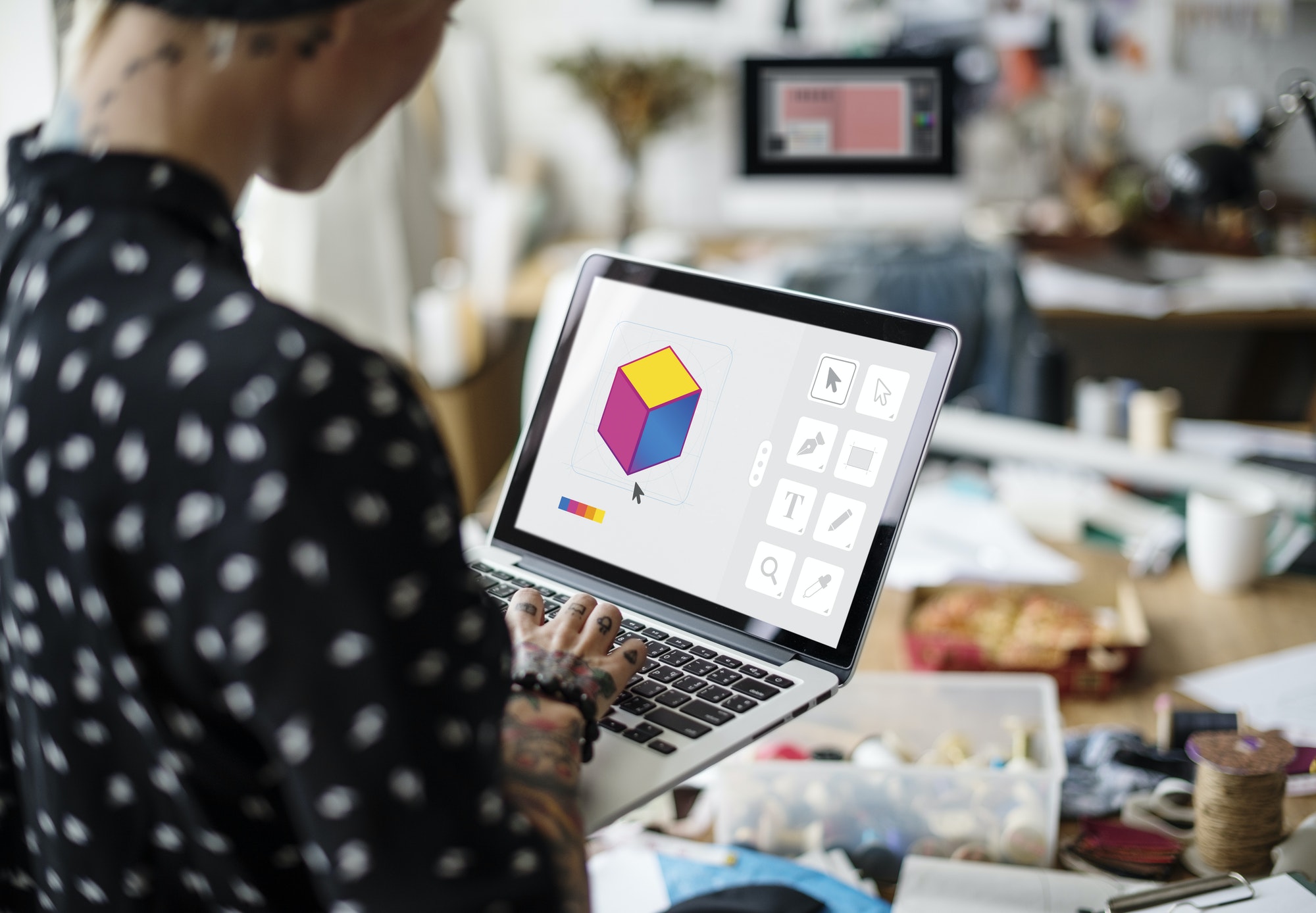 Free design resources being used by a graphic designer