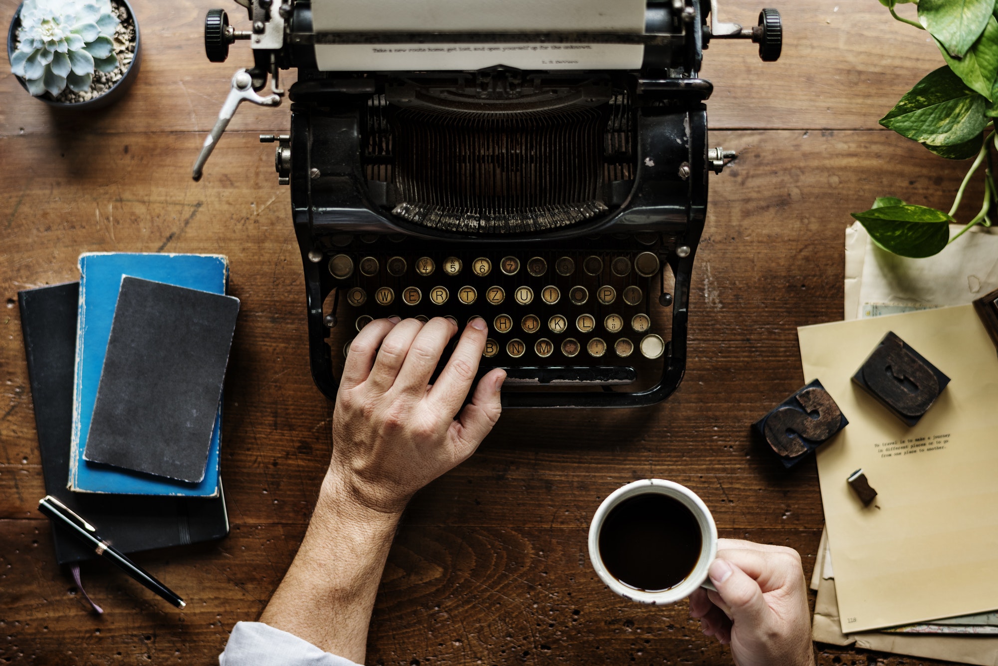 Using a typewriter to write with a personal touch.