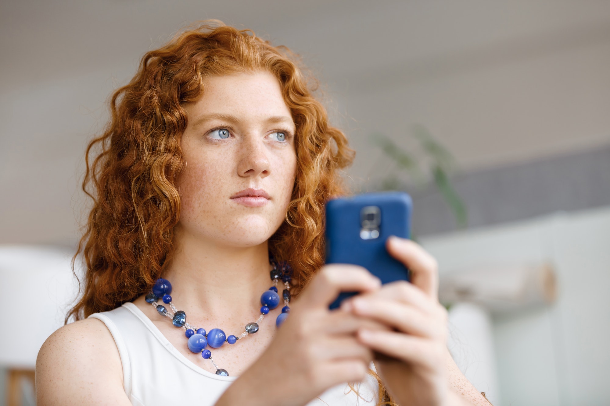 Internet Users No Longer Means Someone Sitting Behind A Desktop | Matchbox Design Group | St. Louis, MO A girl on her phone showing Internet users no longer means someone sitting behind a desktop