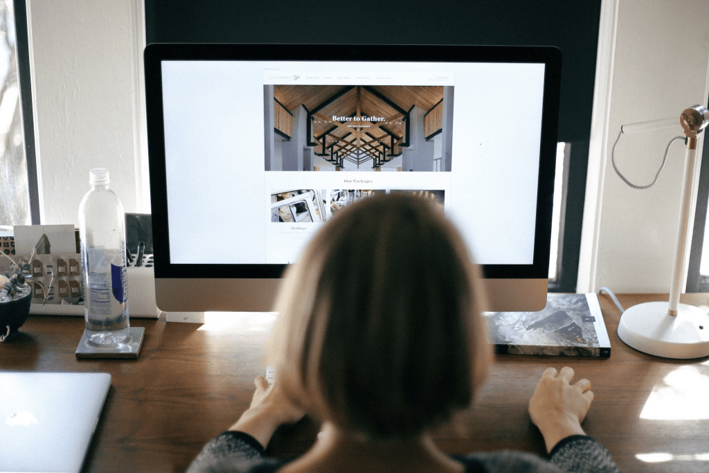 Your Website And Non-Profit SEO | Matchbox Design Group In St. Louis, MO Girl looking at a nonprofit website and deciding if they need SEO.