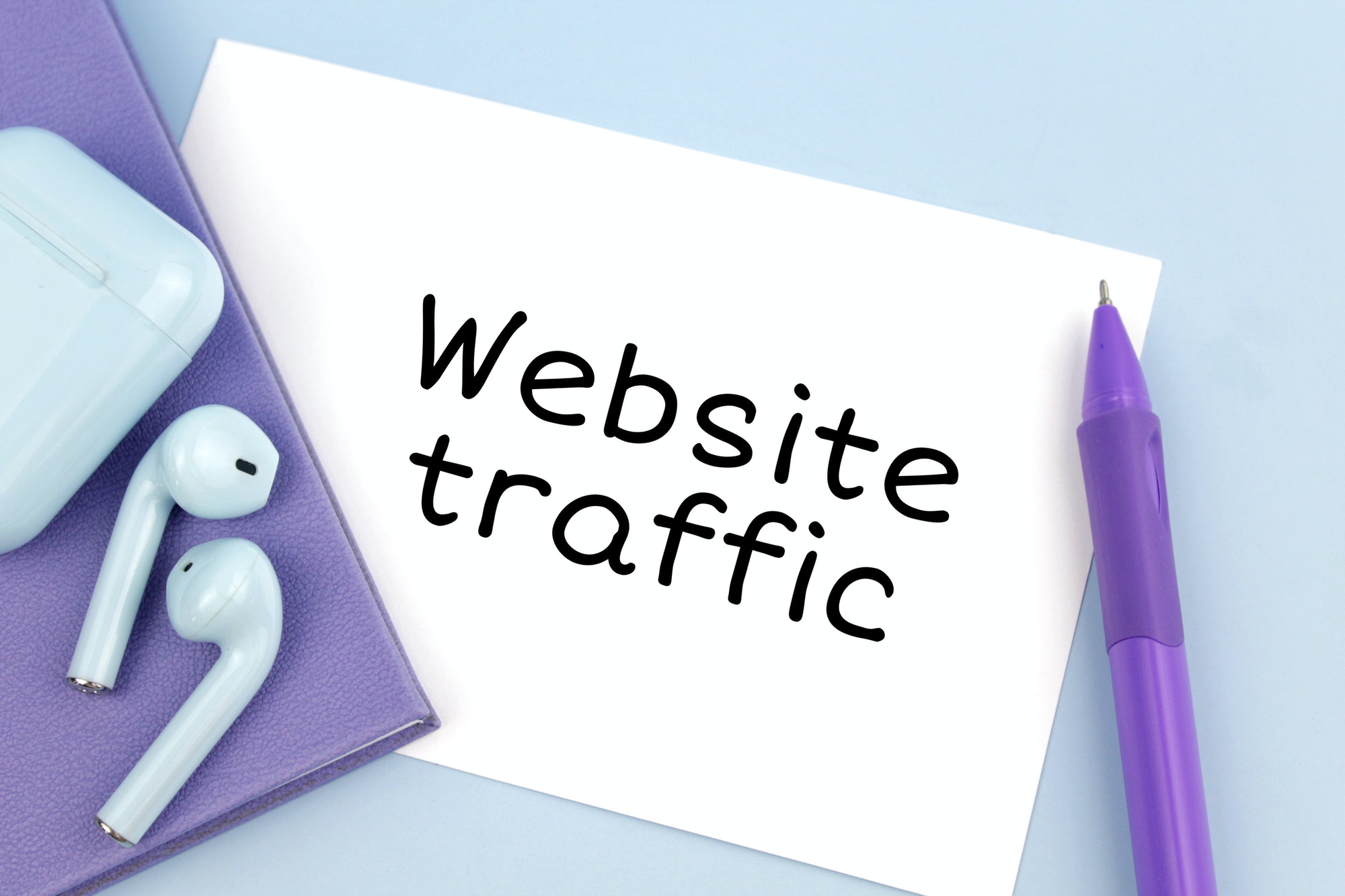 Website traffic written on paper. Website's use SEO to gain traffic.