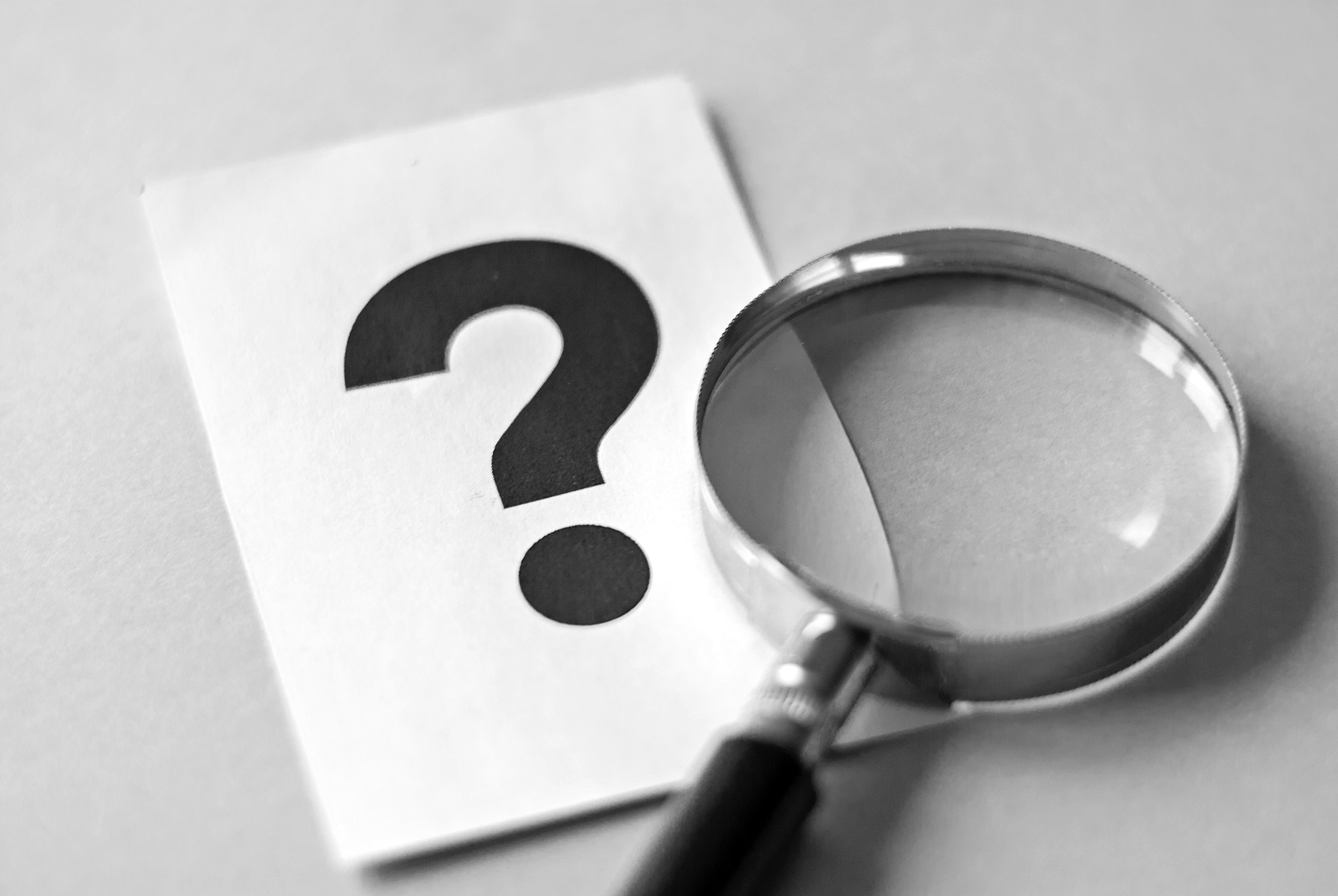 Brand Searches Impact Search Results | Matchbox Design Group | St. Louis, MO Magnifying glass and question mark for branded searches