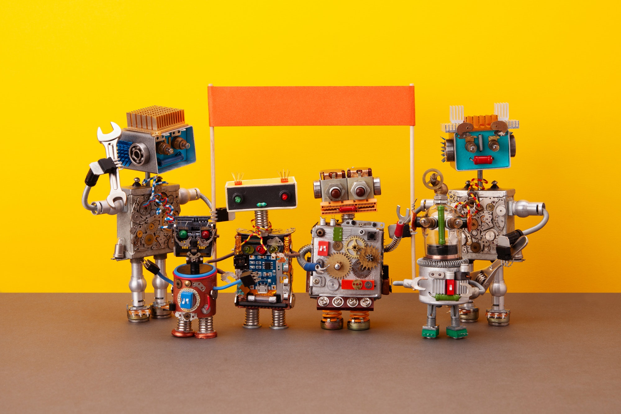 These robots need tips for slogan creation on their banner.