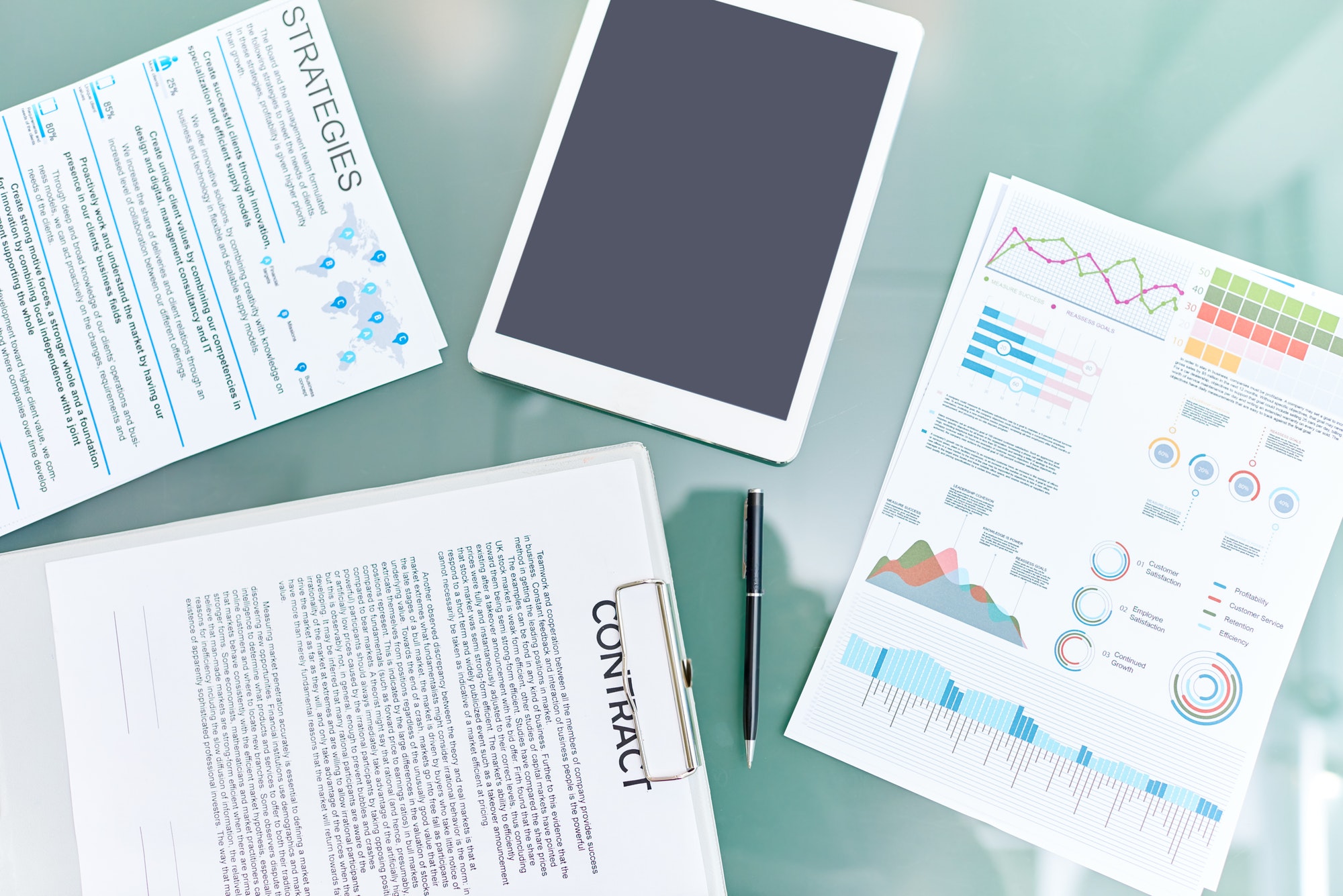 Meeting table with documents from a paid advertising campaign.