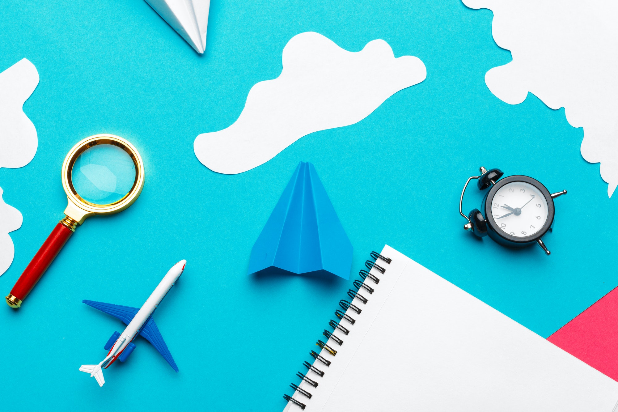 Cloud Migration Strategy. Paper plane on a blue background with clouds.