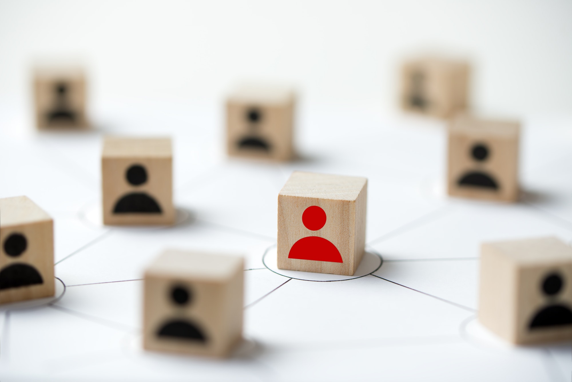 Social media network concept using icon people wooden cube block. Keeping active is important to your business.