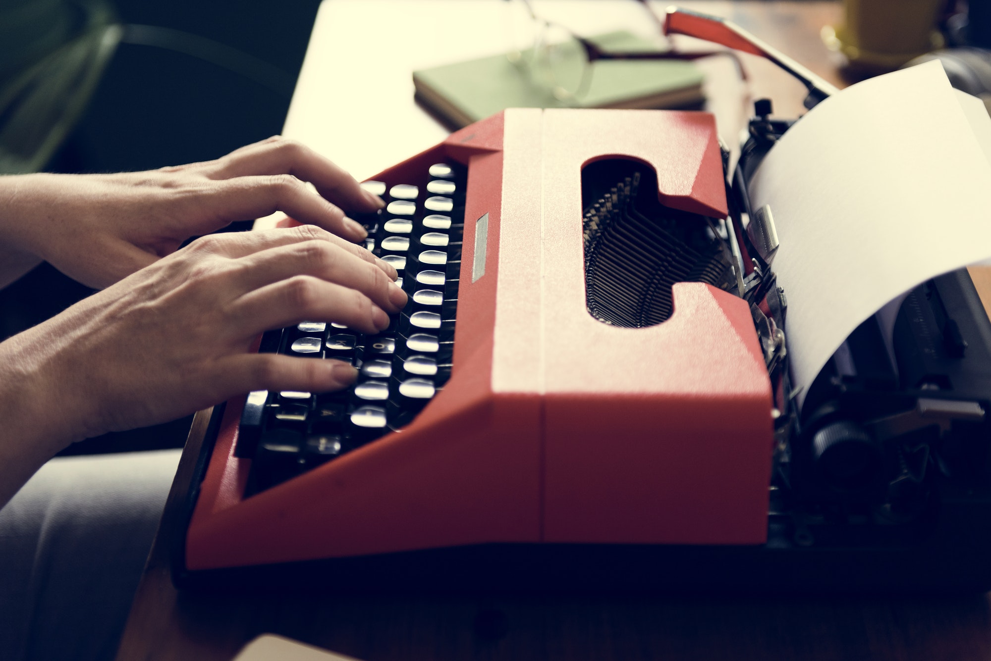 Democratize Content Publishing | Matchbox Design Group | St. Louis, MO Woman typing on a retro typewriter creating content