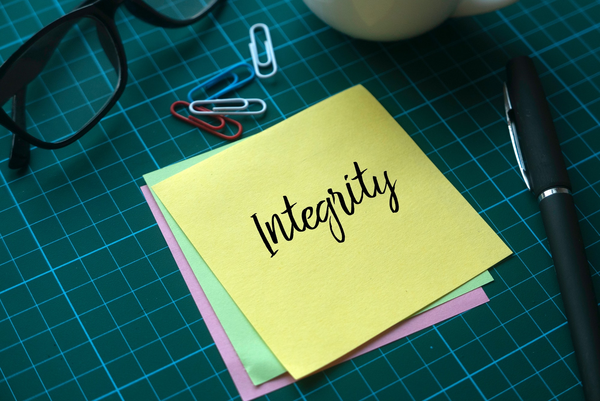 Integrity written on a post-it note.