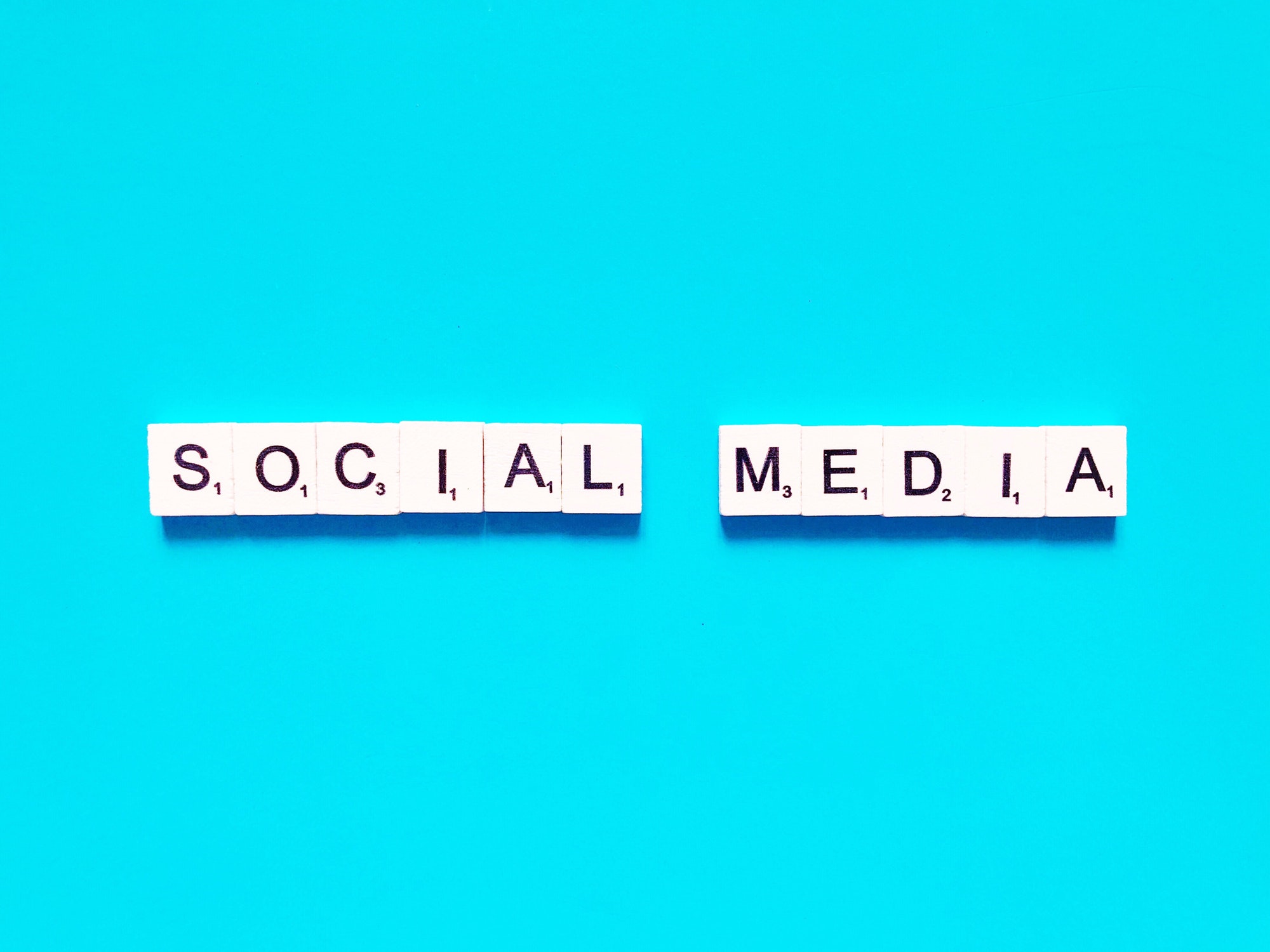 Social media written in scrabble letters. Social Media Marketing Tools To Use In 2022 For An Outburst!