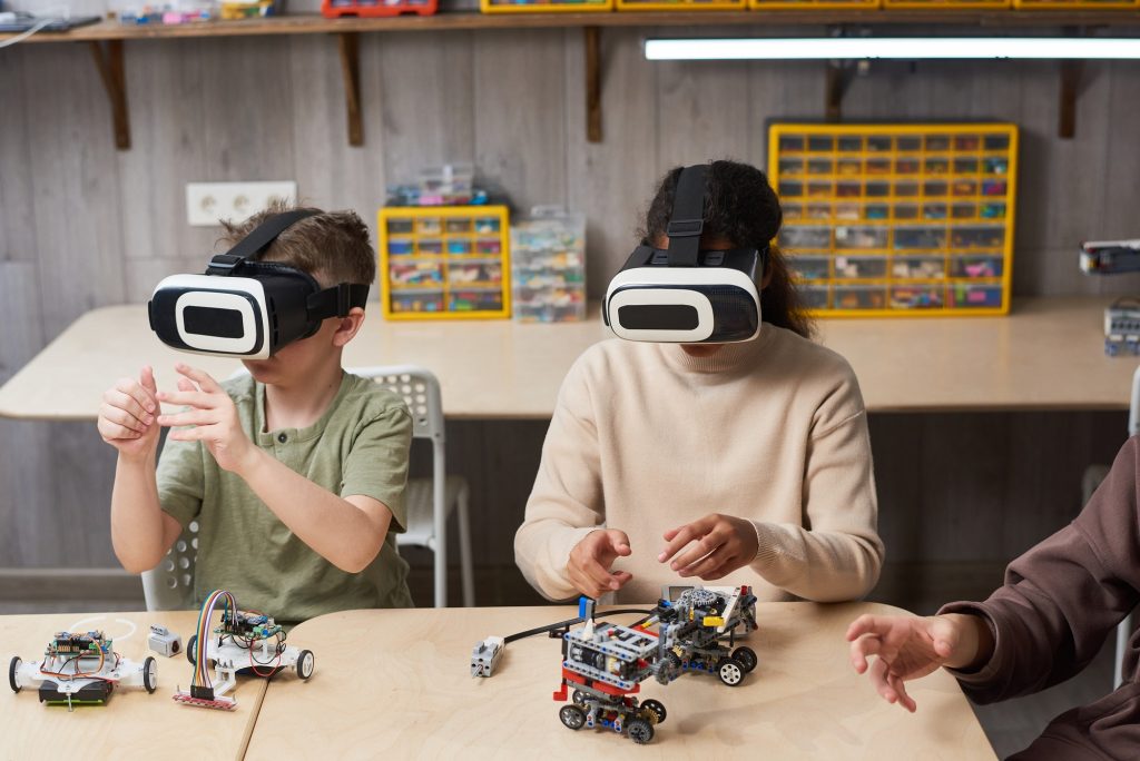 VR And AR | Matchbox Design Group | St. Louis, MO Kids using VR headsets. AR Vs. VR helps us with how web 3.0 will impact real estate marketing.