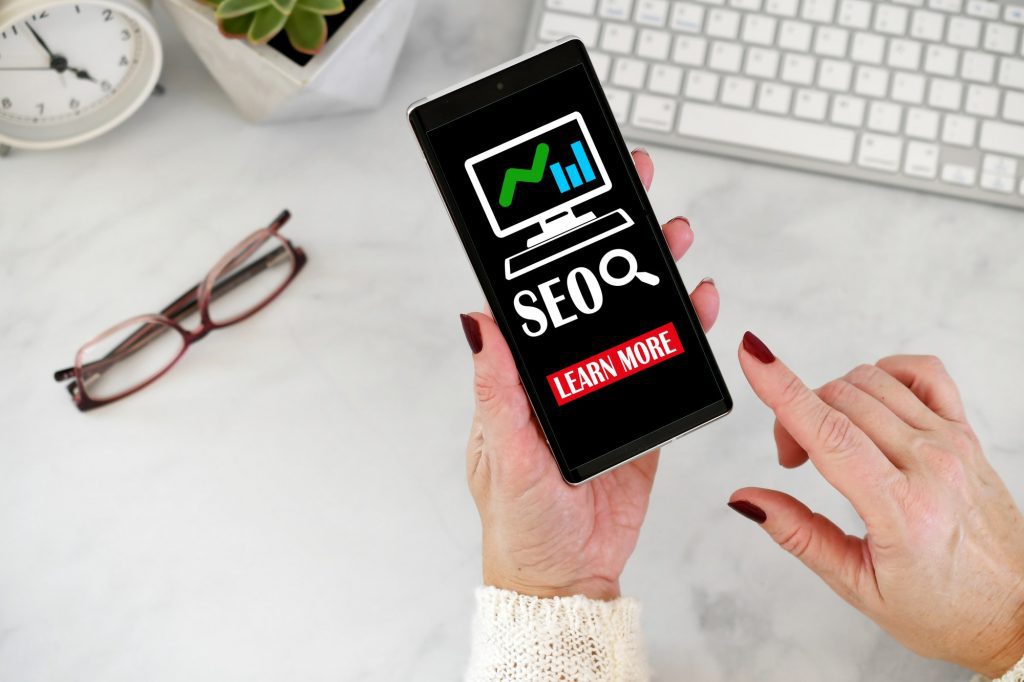 Optimize Images For Your Website | Matchbox Design Group Woman learning how to optimize images using SEO.