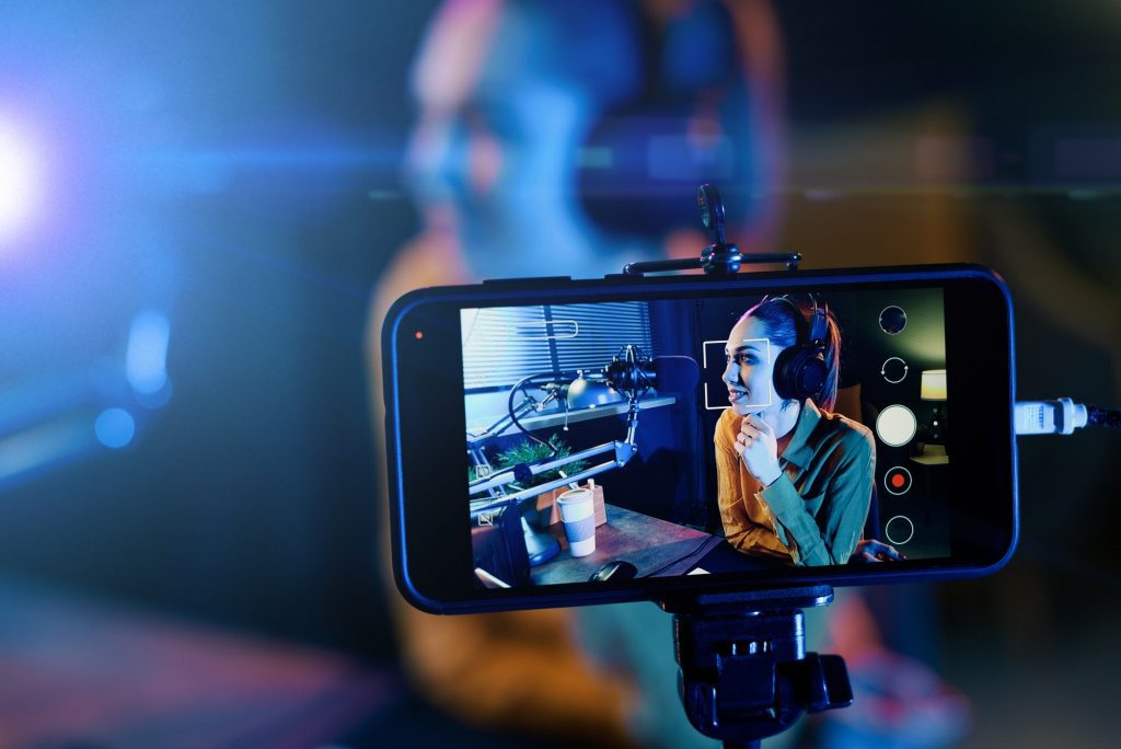 Add Visual Assets To Your Long-Form Content | Matchbox Design Group Young woman streaming a live video.