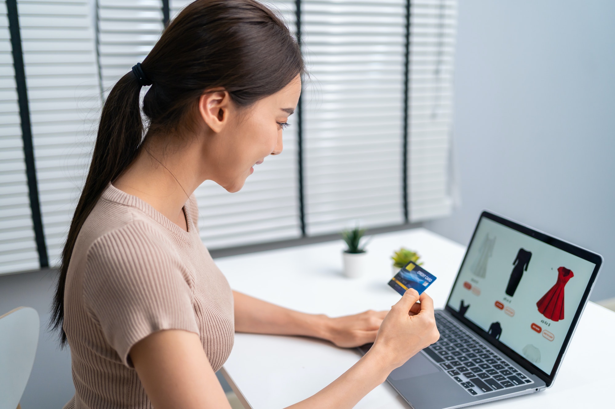 Woman using an online shopping cart.
