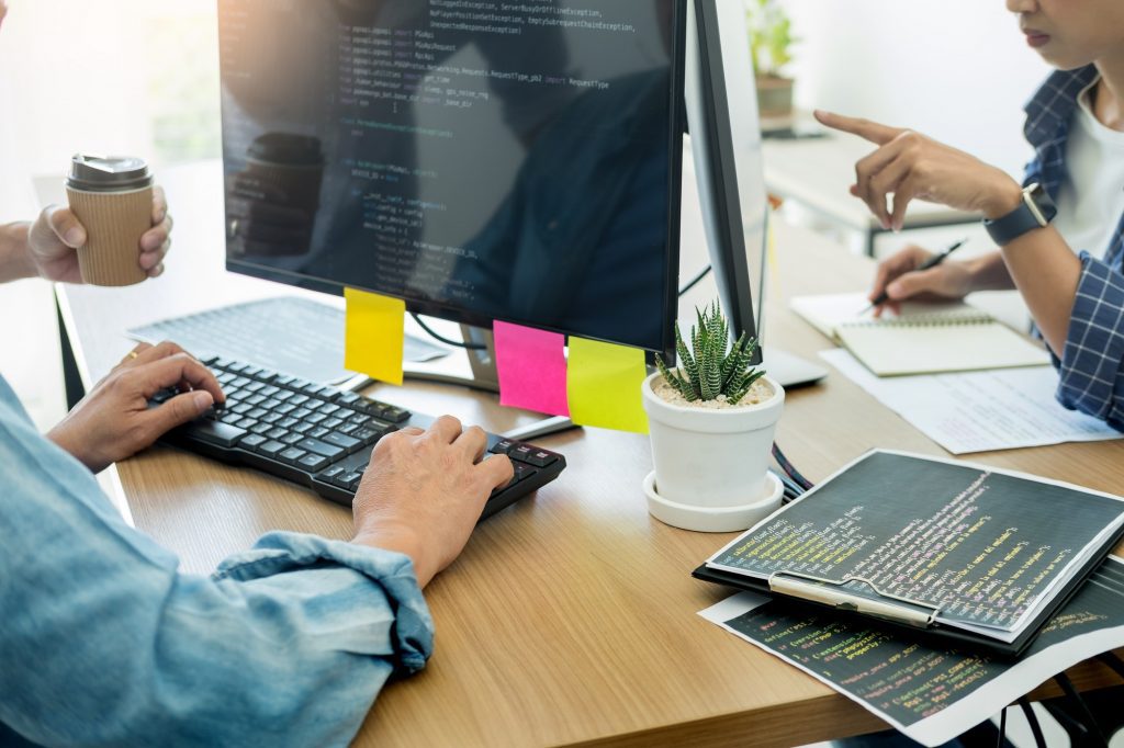 Why good design matters. Man and woman designing a website.