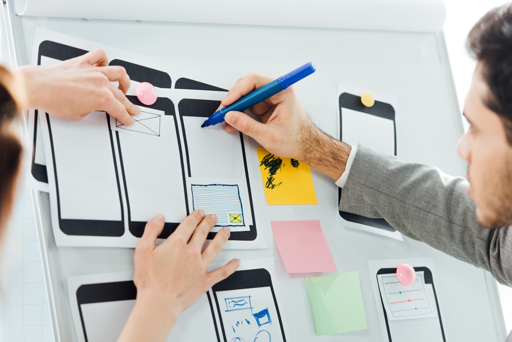 Coworkers working on web design. 10 Tips Every Web Developer Should Know.