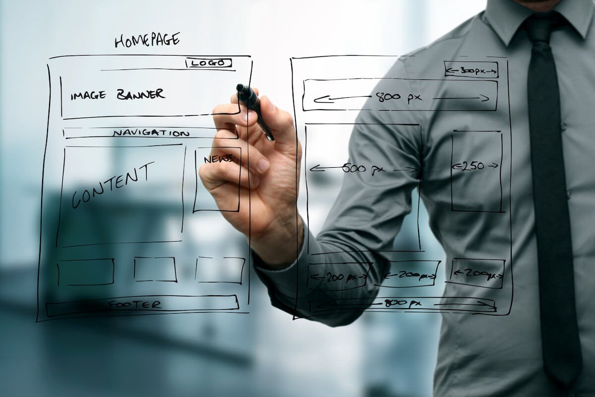 Man Going Over 7 Crucial Design Elements Every Website Homepage Should Have.