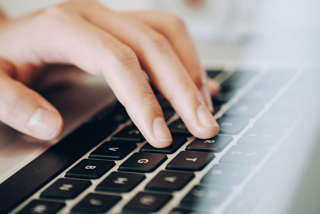 Organize Remote Work | Matchbox Design Group In St. Louis Person using a laptop while they organize remote work.