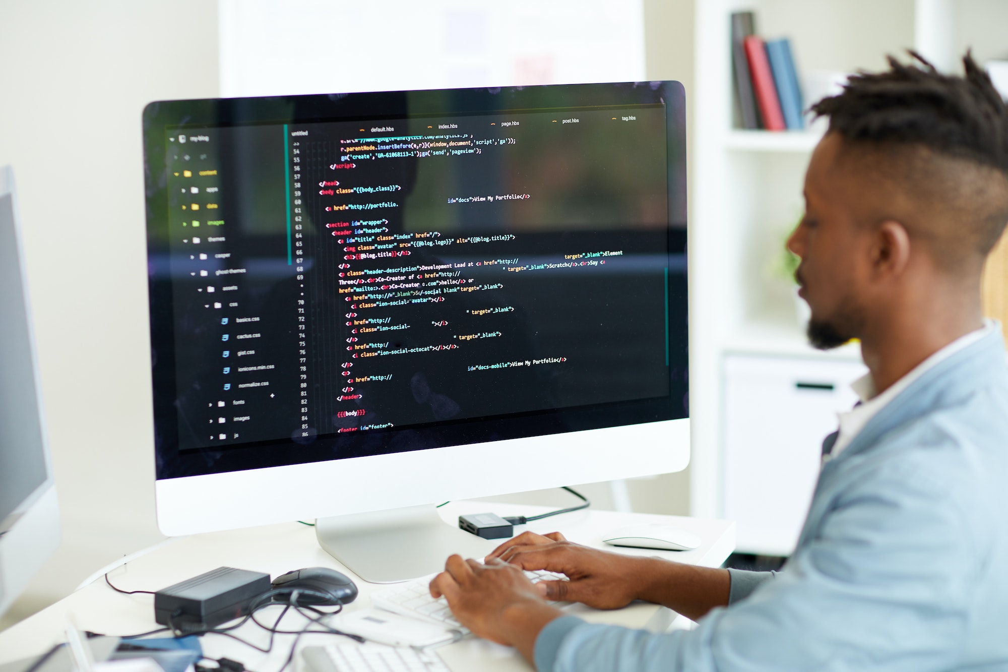 Web developer coding website at computer