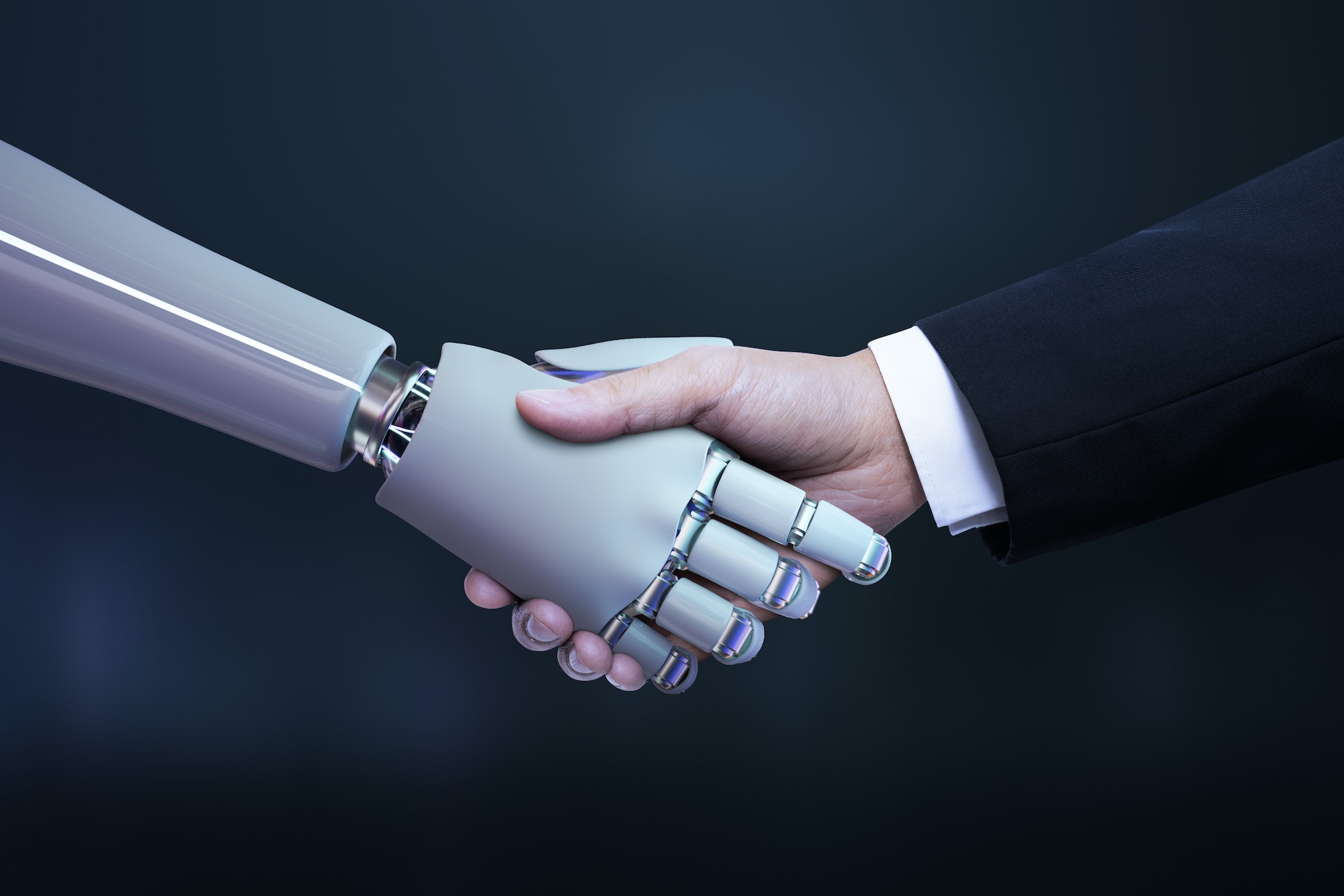 Business hand robot handshake representing marketing automation.