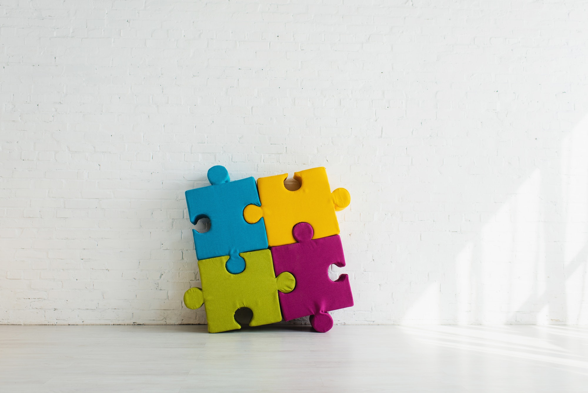 Colorful jigsaw puzzle pieces connected to match the symbol for Google Chrome extensions