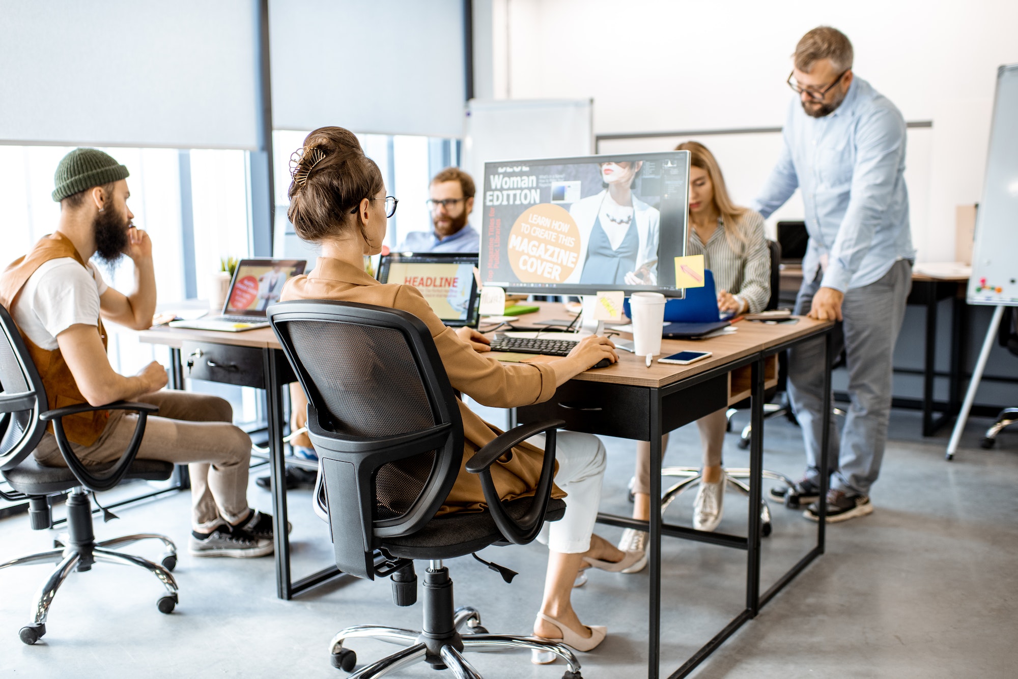 Professional web designers working at the office