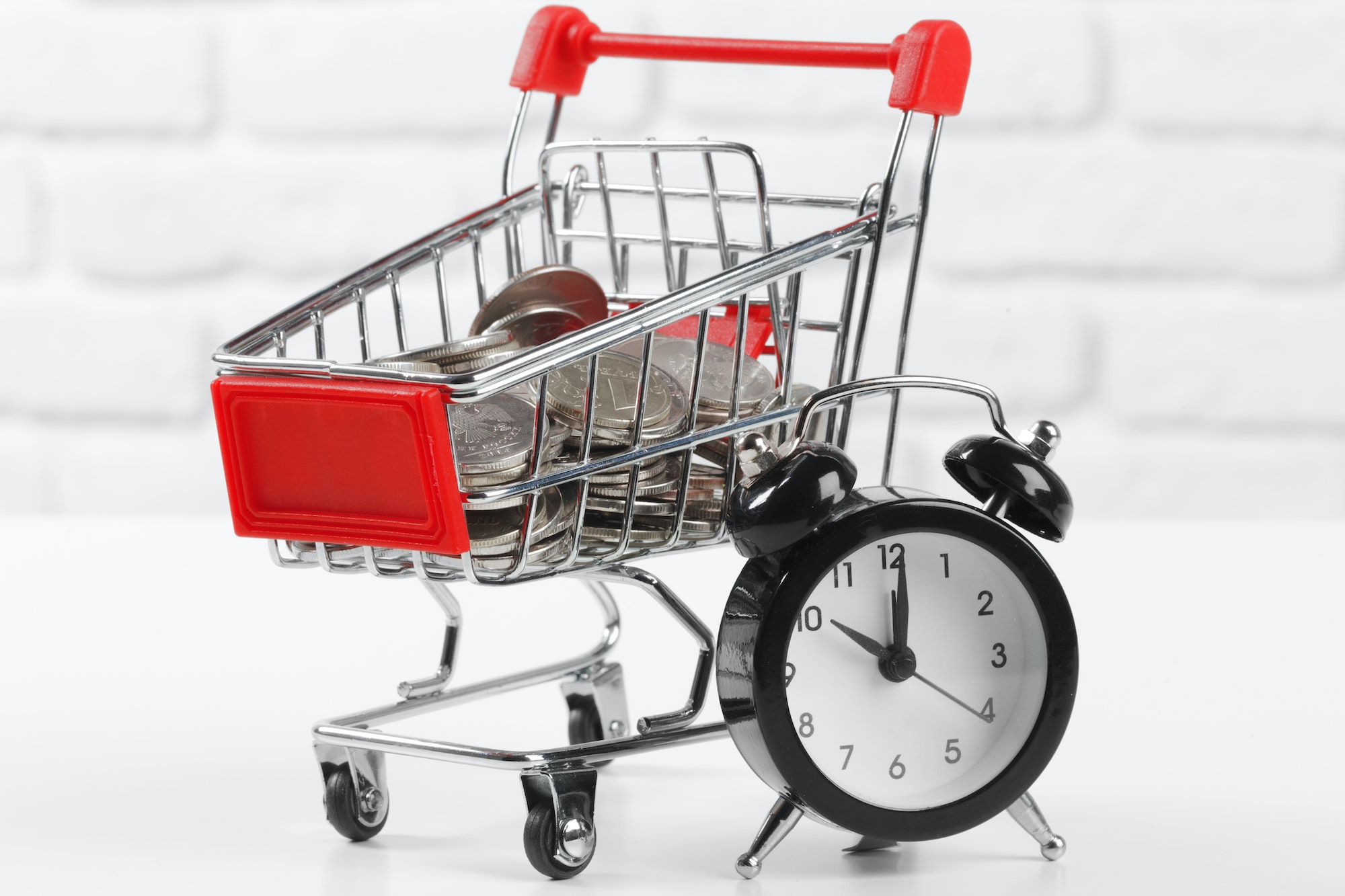 Cart and clock representing how to stay popular in the eCommerce world.