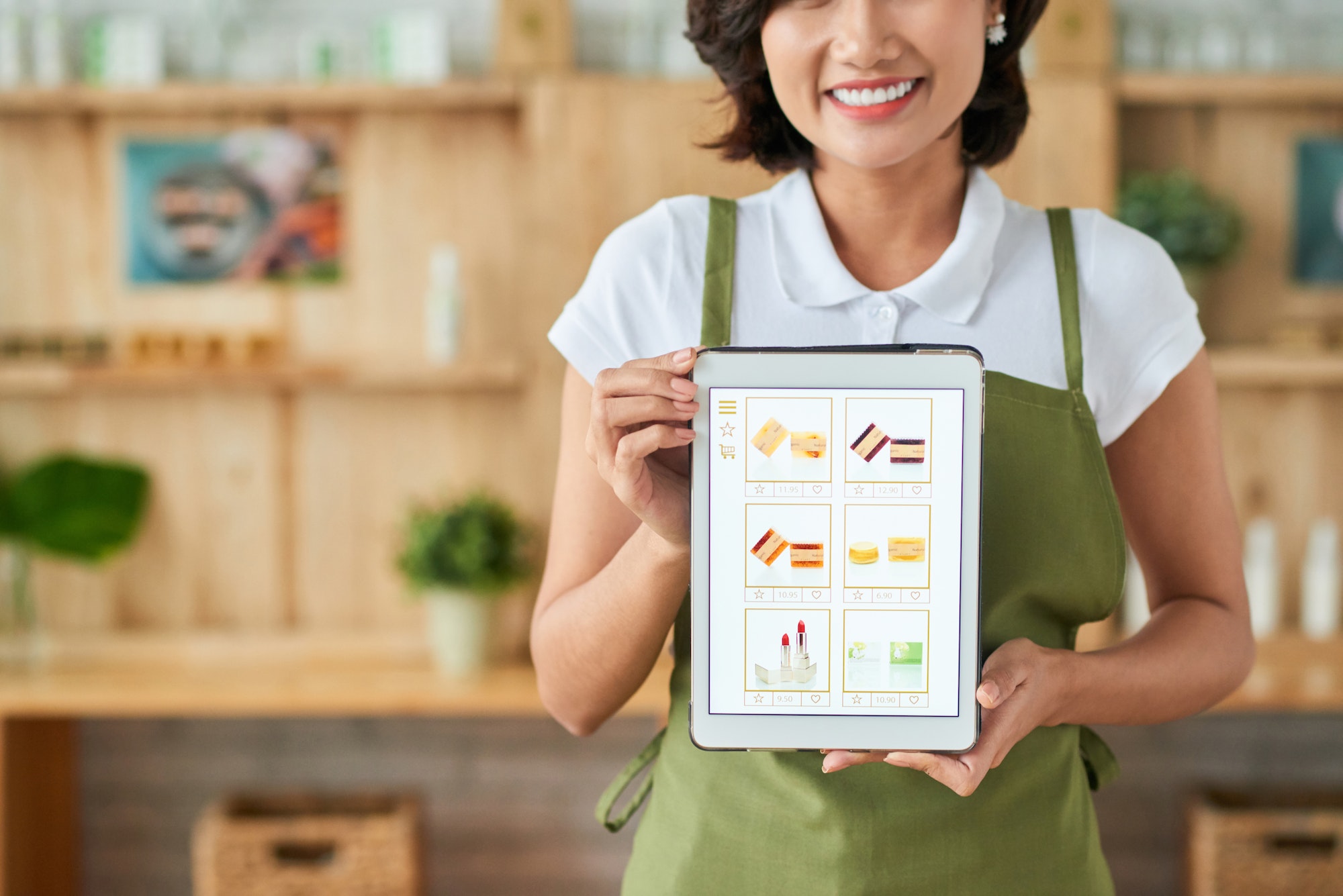Woman holding up an example of what Building An eCommerce Product Page can do for your business.