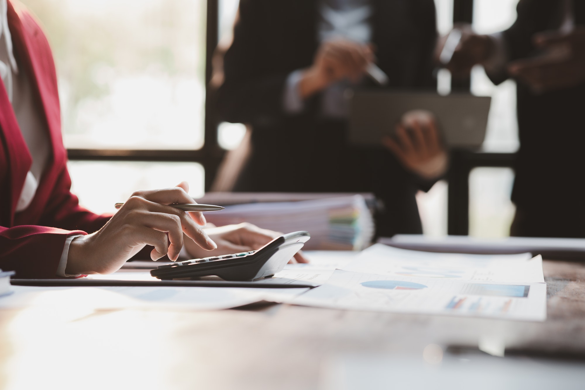 Generate More Sales By Redesigning Your Website. Person counting sales.