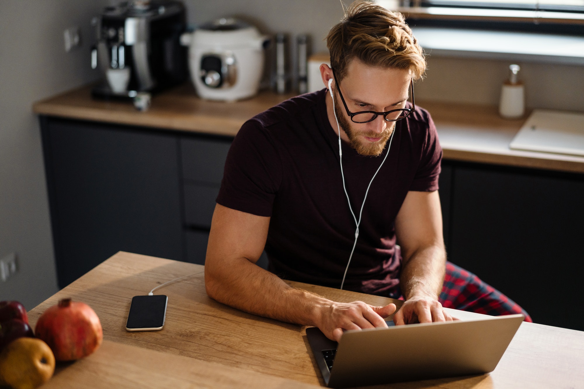 Young Man Working Remotely. The Best Team Collaboration Tools For Online, Remote & In-Person Teams