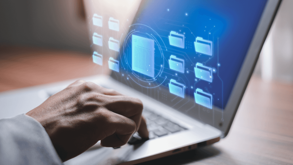 knowledge management system icons hovering from a laptop