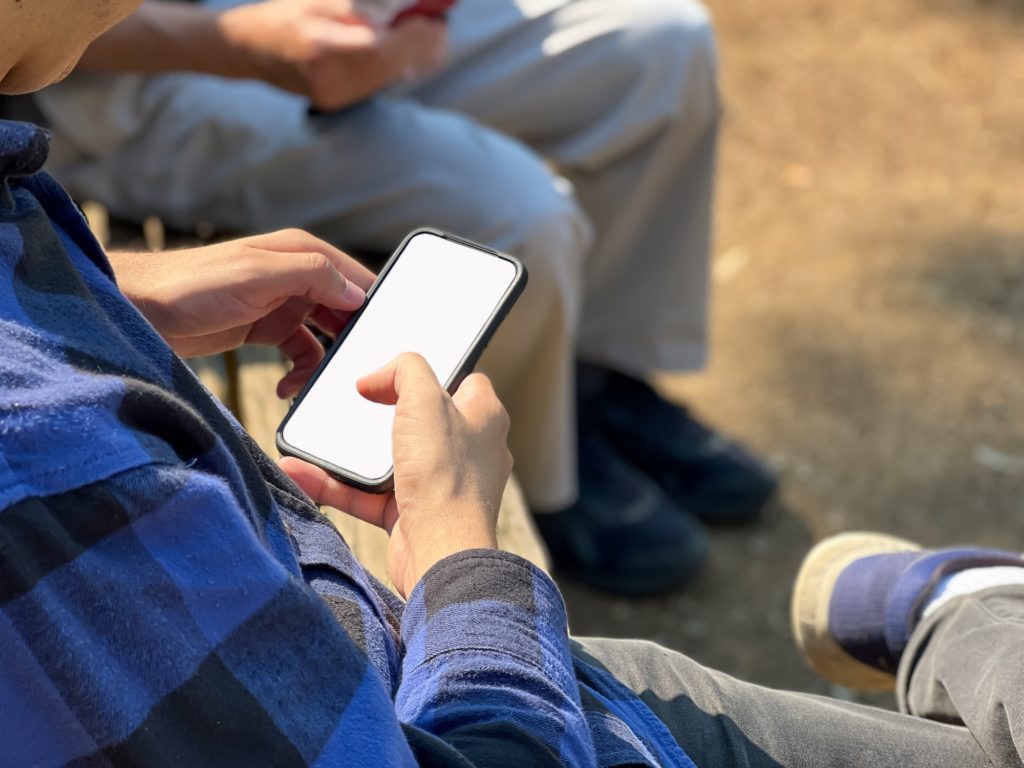 Mobile-Friendliness | Matchbox Design Group | St. Louis, MO Male Mobile Device. Healthcare Industry Web Design Trends For 2023.