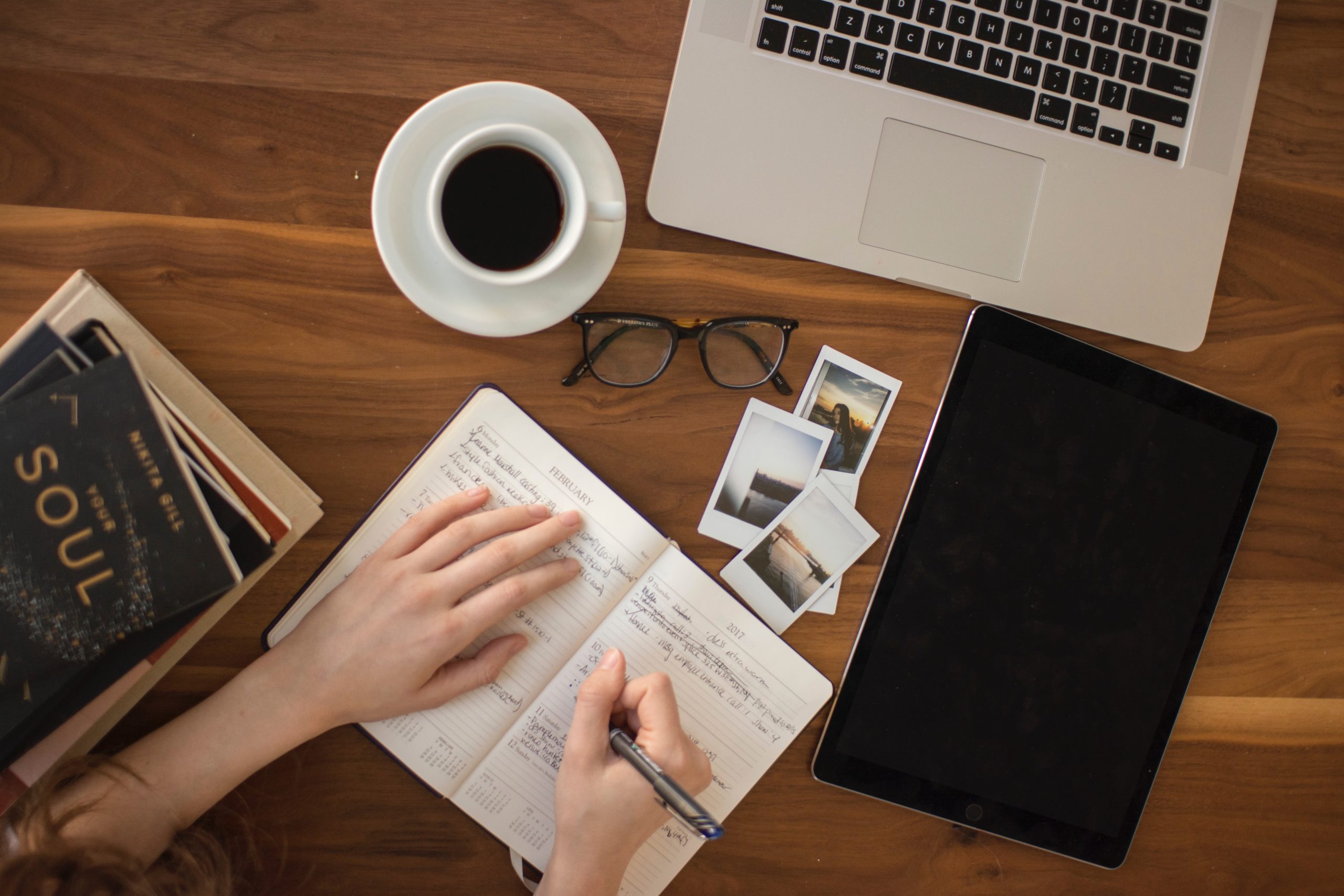 A person working on content writing on a desk
