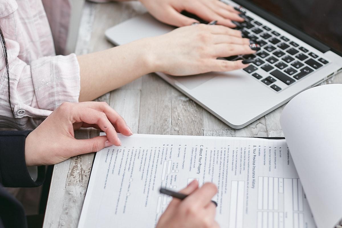 two people putting together a website design contract.