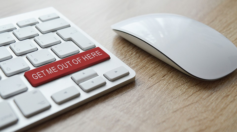 a keyboard with a key that says "get me out of here"