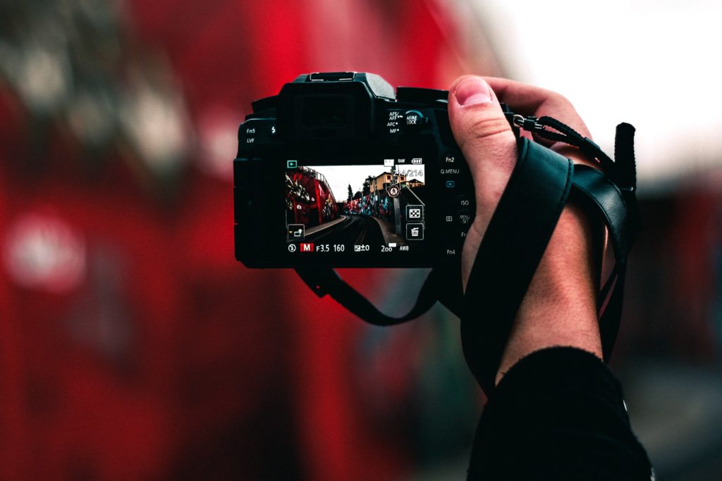 A photographer holding a camera