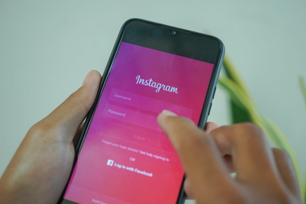 A person entering a password into the instagram login page