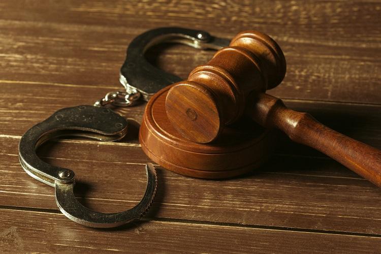 a gavel and handcuffs