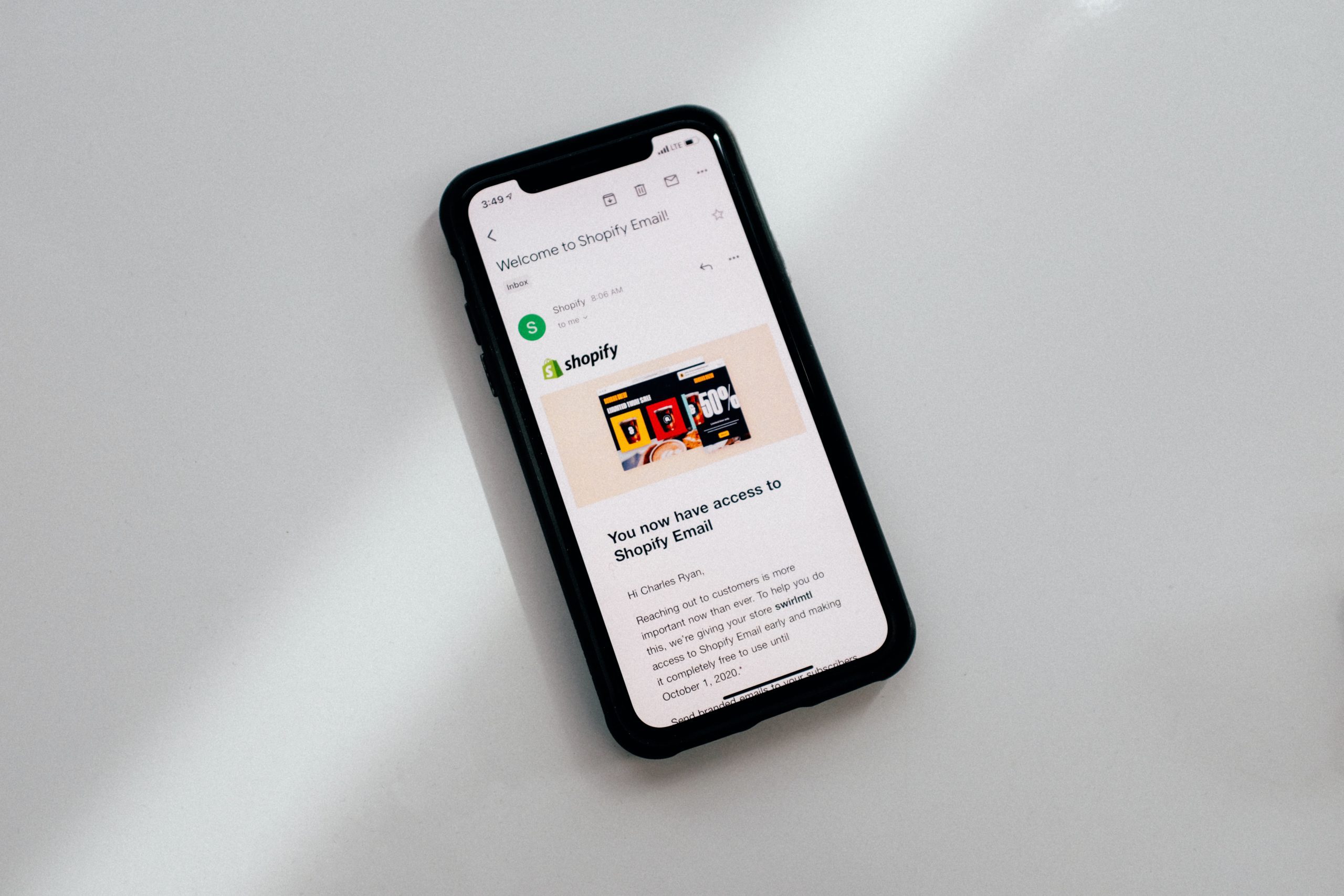 A phone with shopify open. Shopify Website Design.