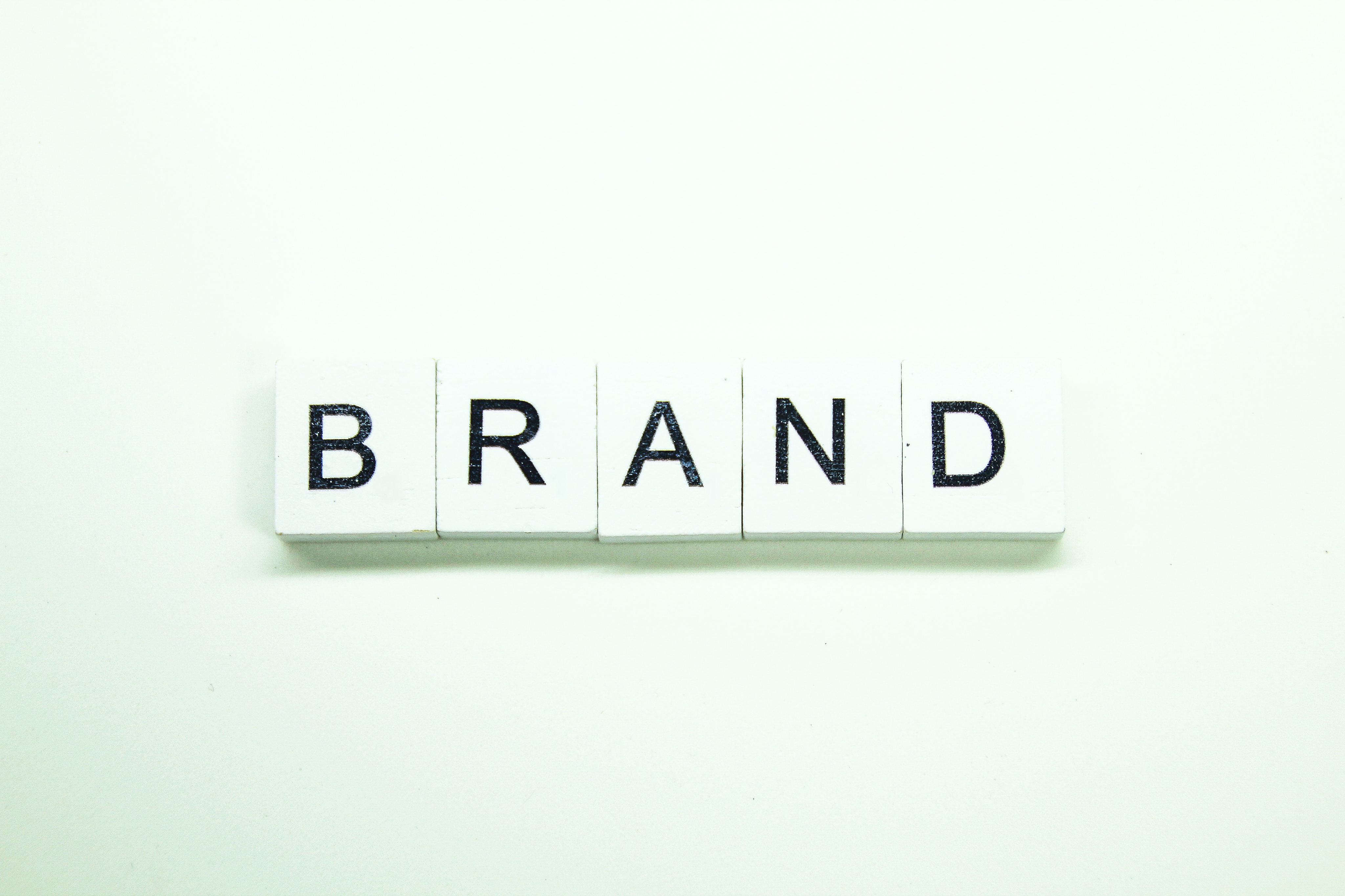 Brand spelled out with scrabble letters.
