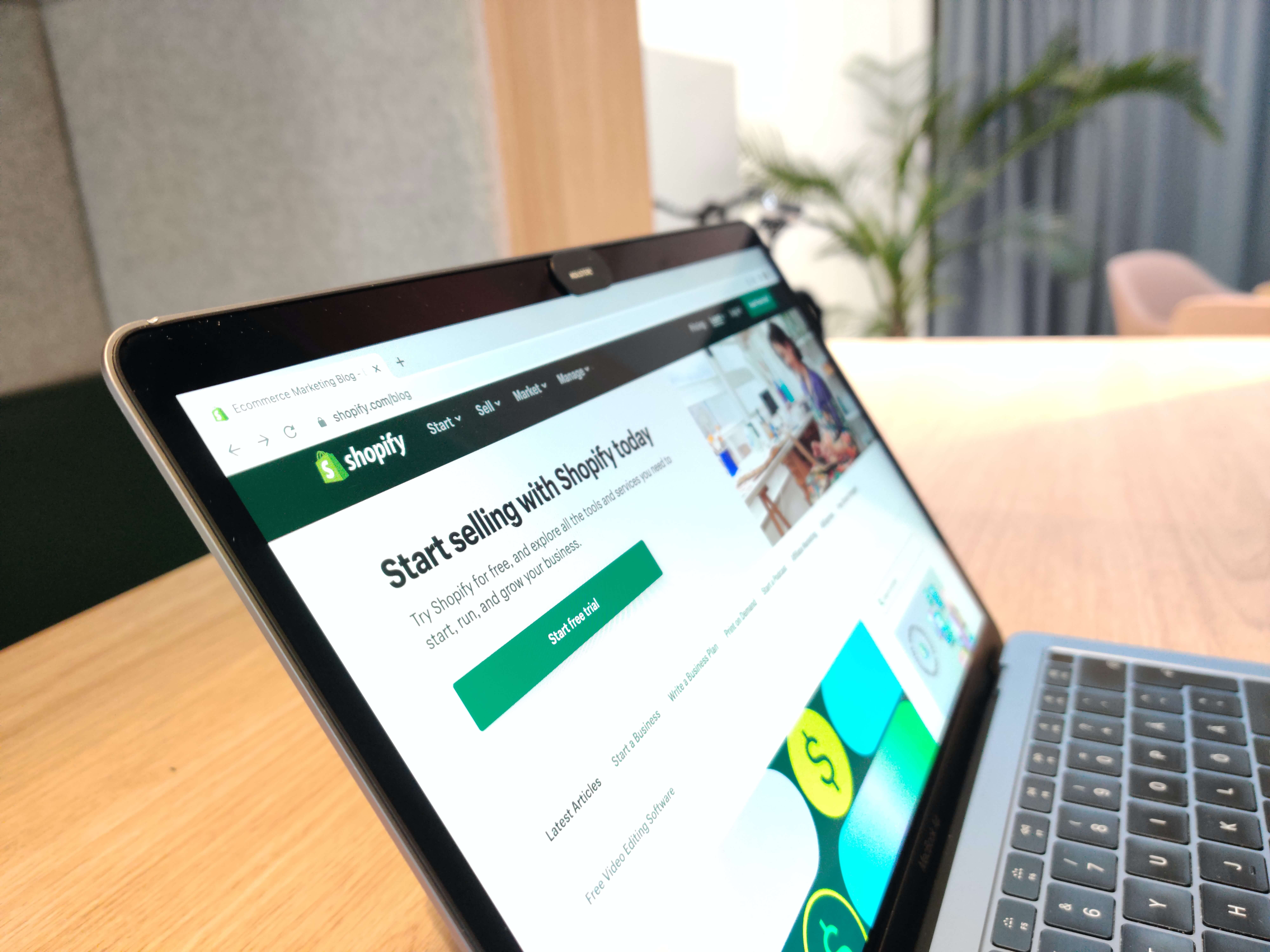 A laptop with shopify on the screen